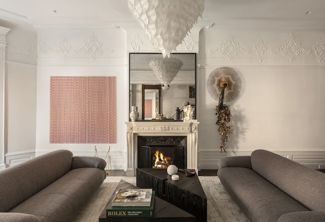 living area with wood finished floors and a premium fireplace