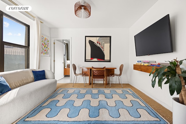 living room featuring visible vents, baseboards, and carpet floors