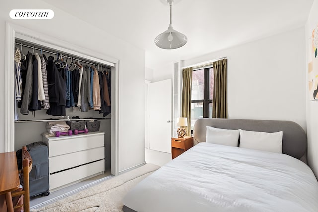 carpeted bedroom with a closet and visible vents