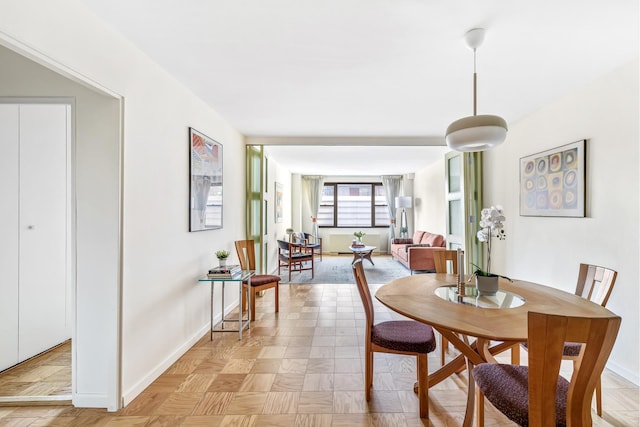 dining space with baseboards