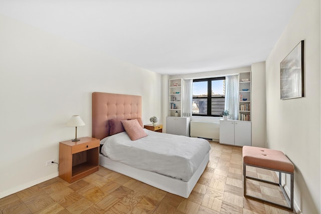 bedroom featuring baseboards
