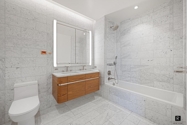 110 Charlton St Unit 20-G, New York City, NY 10014 - bathroom with tiled shower / bath combo, double vanity, toilet, and tile walls