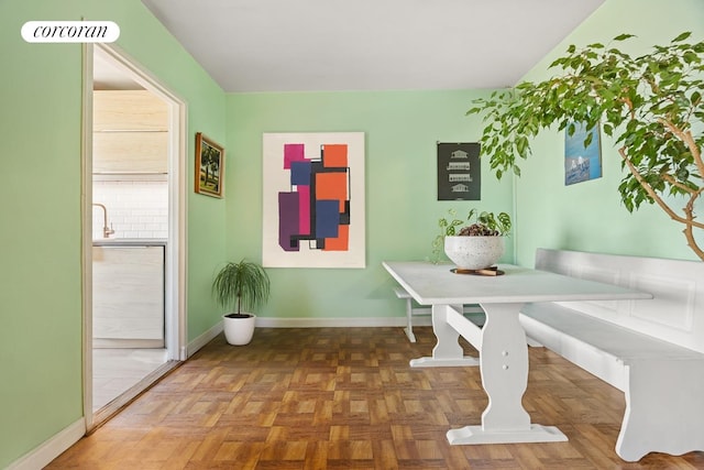 dining space featuring breakfast area, visible vents, and baseboards