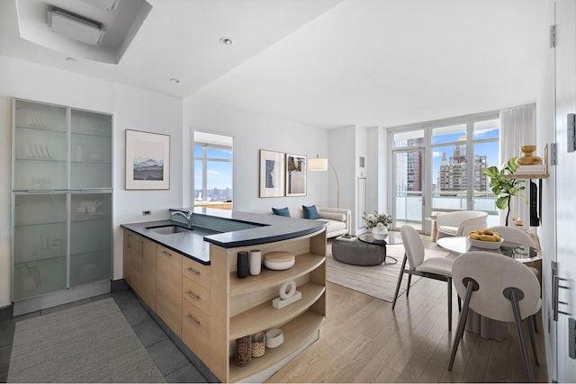 kitchen featuring dark countertops, plenty of natural light, modern cabinets, and open shelves