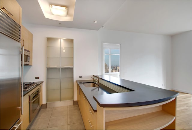 kitchen featuring open shelves, stainless steel appliances, dark countertops, and light tile patterned floors