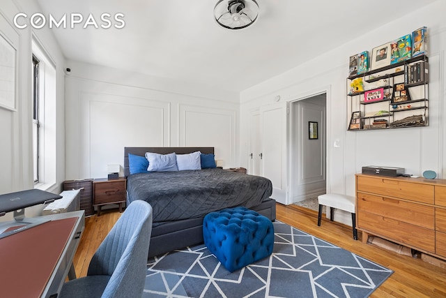 bedroom with wood finished floors