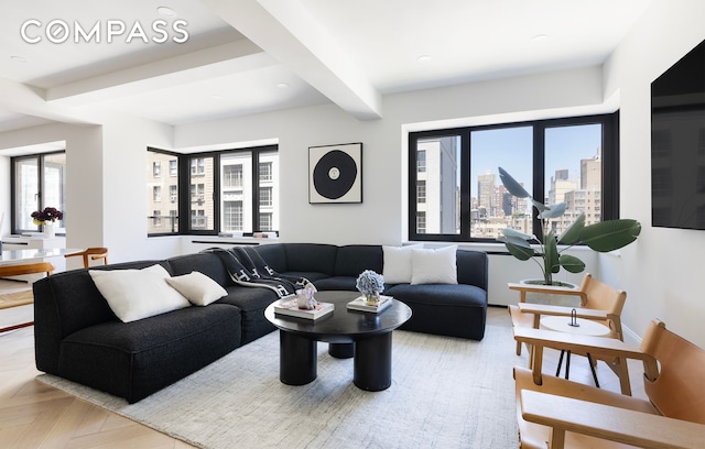 living room featuring recessed lighting, beamed ceiling, and baseboards