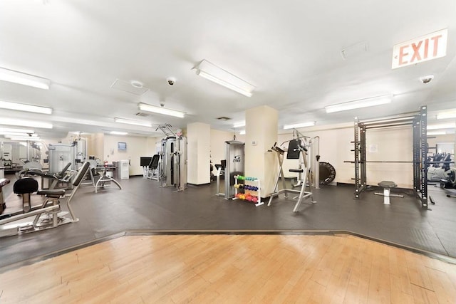 exercise room with wood finished floors