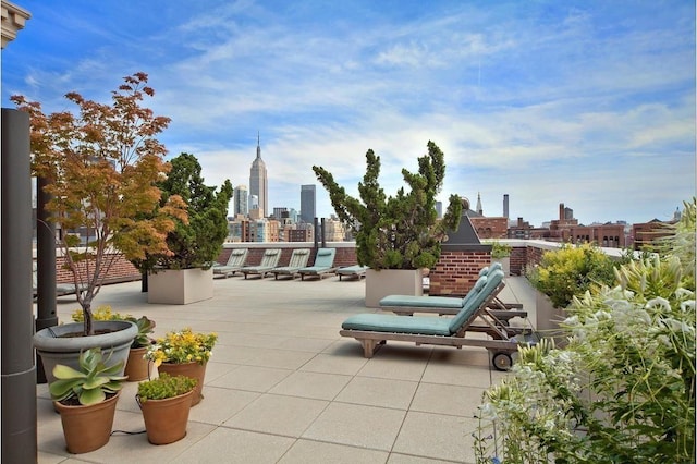 view of patio with a city view and a balcony