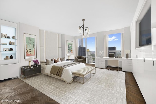 bedroom featuring a notable chandelier and a city view