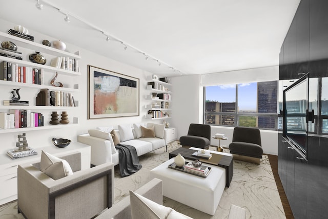 15 W 53rd St Unit 37Af, New York City, NY 10019 - living area featuring rail lighting and wood finished floors