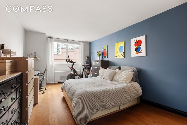 bedroom with light wood-style floors