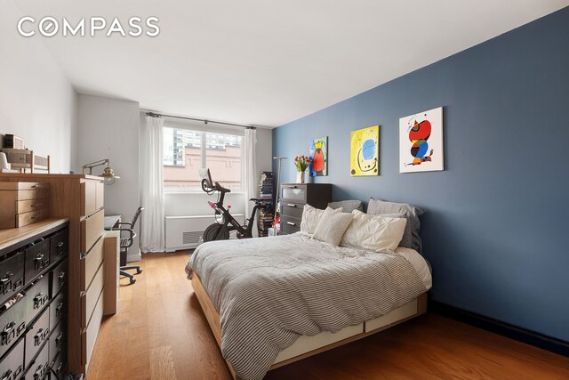 200 E 94th St Unit 420, New York City, NY 10128 - bedroom featuring light wood-type flooring
