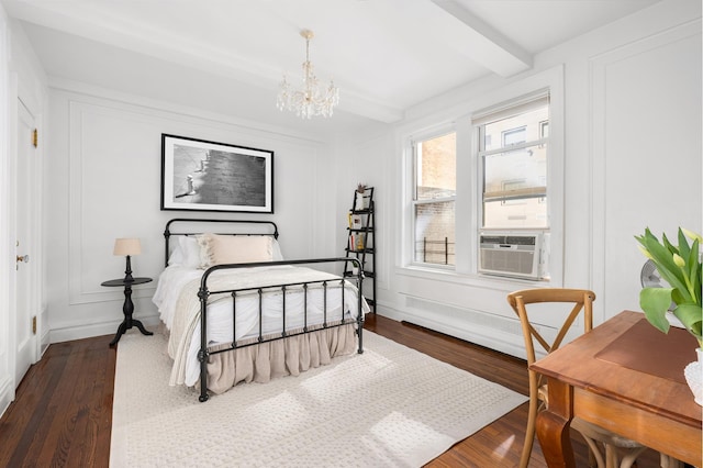 bedroom with cooling unit, beam ceiling, dark wood-style flooring, a decorative wall, and a chandelier