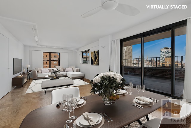 dining area featuring a ceiling fan