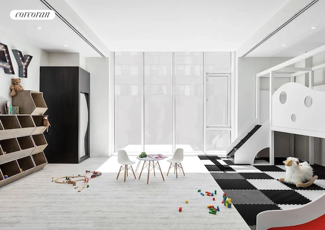 bedroom featuring refrigerator and visible vents