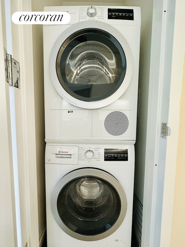 laundry room featuring laundry area and stacked washer and clothes dryer