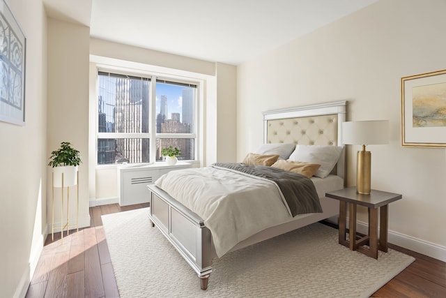 146 W 57th St Unit 34A, New York City, NY 10019 - bedroom with wood finished floors and baseboards