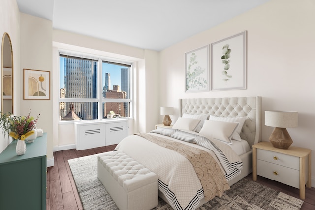 bedroom with a city view and wood finished floors