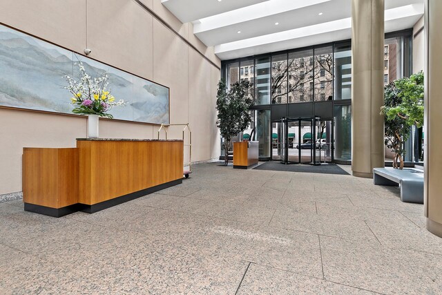 347 W 57th St Unit 3B, New York City, NY 10019 - building lobby with a towering ceiling and recessed lighting