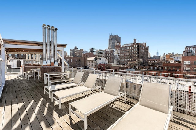 wooden deck with a city view