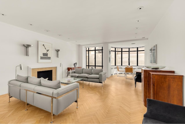 living room featuring a tiled fireplace and recessed lighting