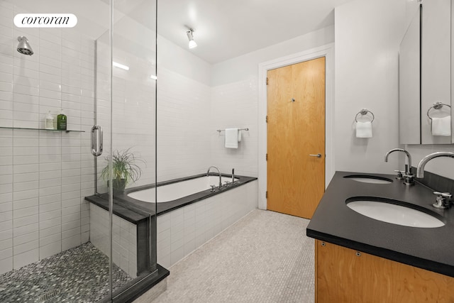 70 Washington St Unit 9G, New York City, NY 11201 - full bathroom with a shower stall, a bath, and double vanity