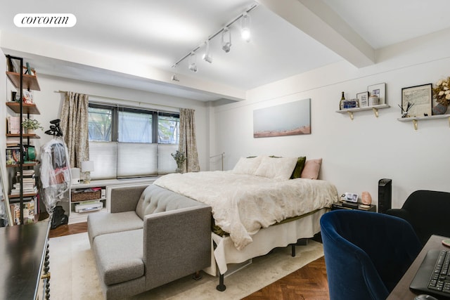 bedroom featuring track lighting