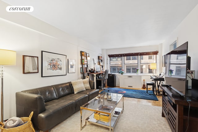 living room with visible vents and wood finished floors