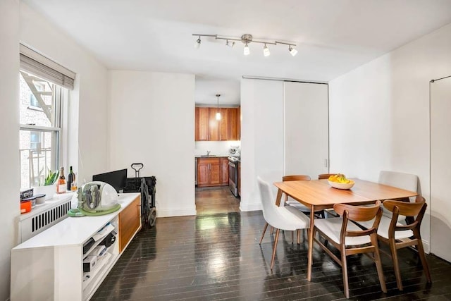 dining room with dark wood-style floors