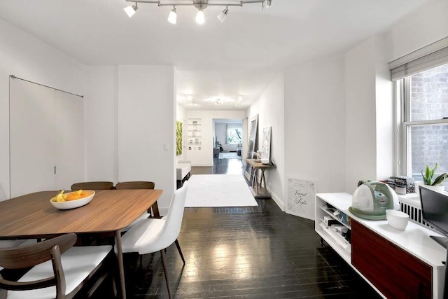 dining space with dark wood-style floors