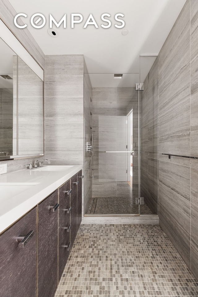 252 S St Unit 43C, New York City, NY 10002 - bathroom with a shower stall, vanity, and tile patterned flooring