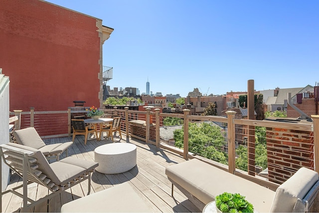 wooden deck with a view of city