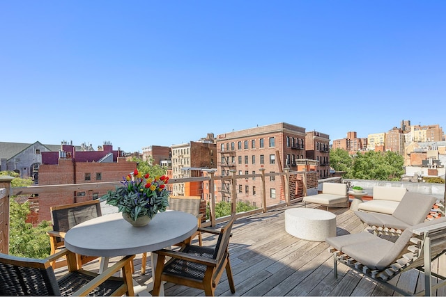 wooden deck with a city view