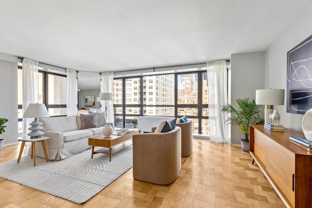 living room with baseboards and floor to ceiling windows