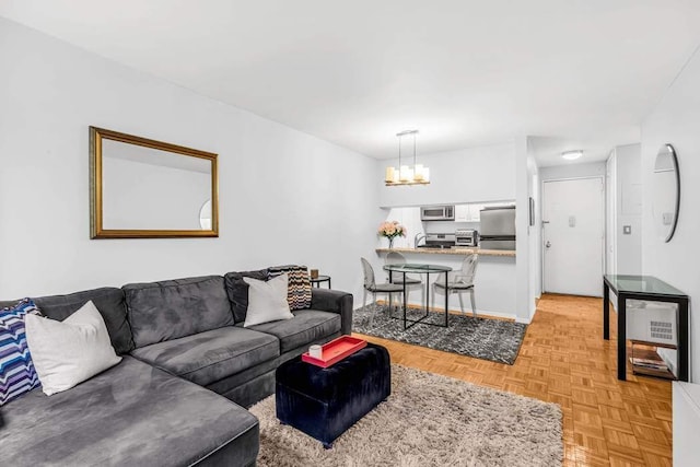 living area featuring an inviting chandelier