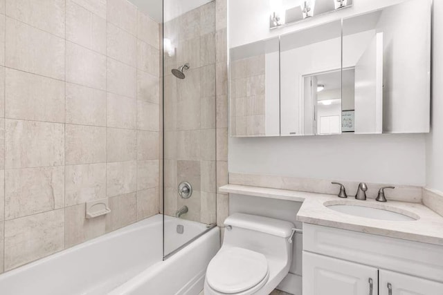 bathroom with vanity, toilet, and shower / bathtub combination