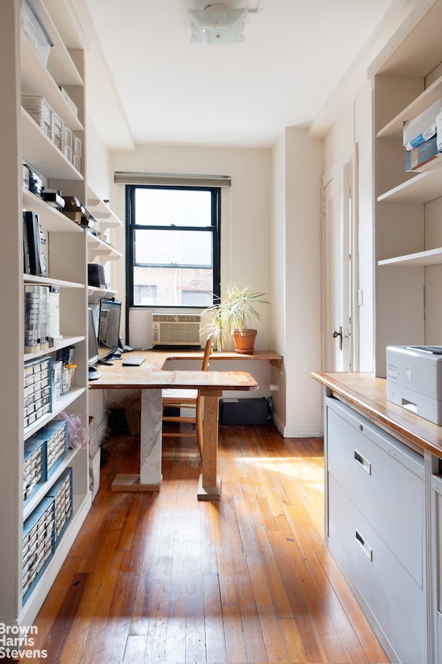 office space featuring light wood-style floors and cooling unit