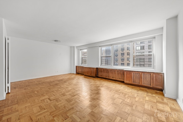 empty room with baseboards