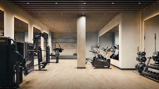 gym with wood finished floors