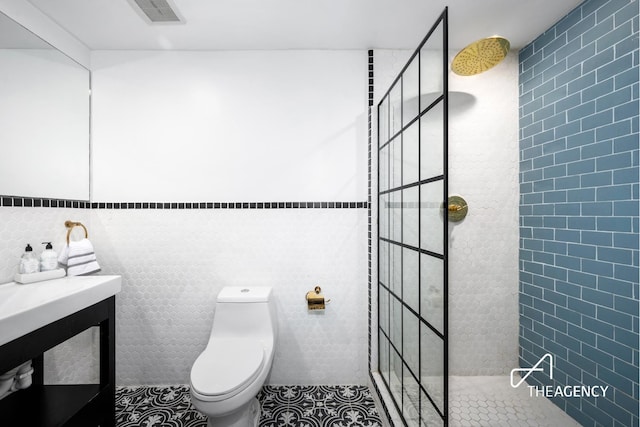 bathroom featuring visible vents, toilet, walk in shower, and tile patterned flooring