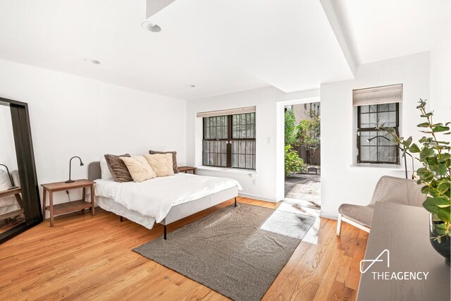 146 W 136th St, New York City, NY 10030 - bedroom featuring access to exterior, light wood-style floors, and recessed lighting