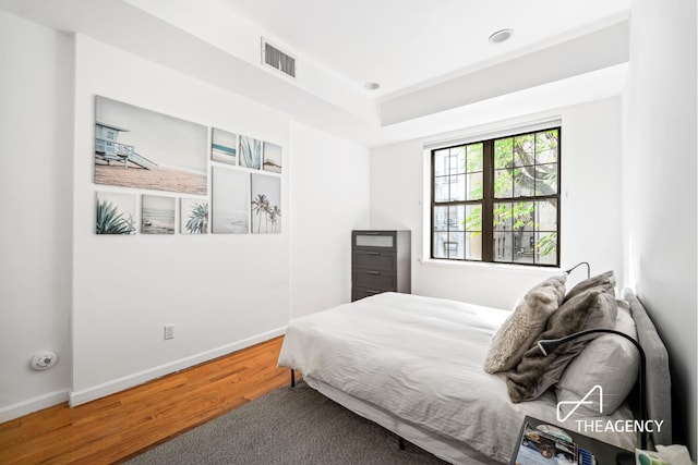 146 W 136th St, New York City, NY 10030 - bedroom featuring wood finished floors and baseboards