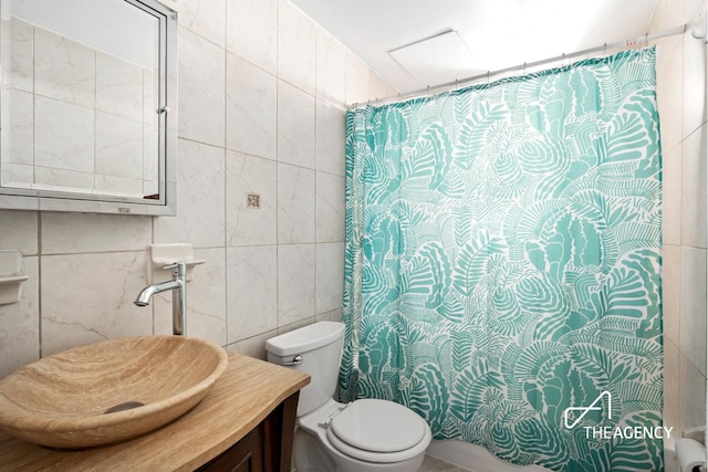 bathroom featuring a shower with curtain, toilet, tile walls, and vanity