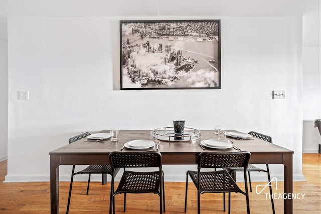 dining room with wood finished floors and baseboards