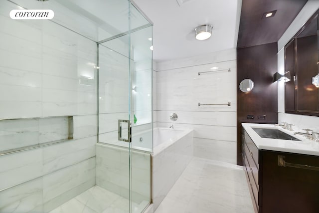 151 E 85th St Unit 15J, New York City, NY 10028 - bathroom with a bath, a shower stall, vanity, and marble finish floors