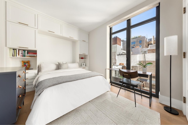 bedroom featuring light wood-style flooring