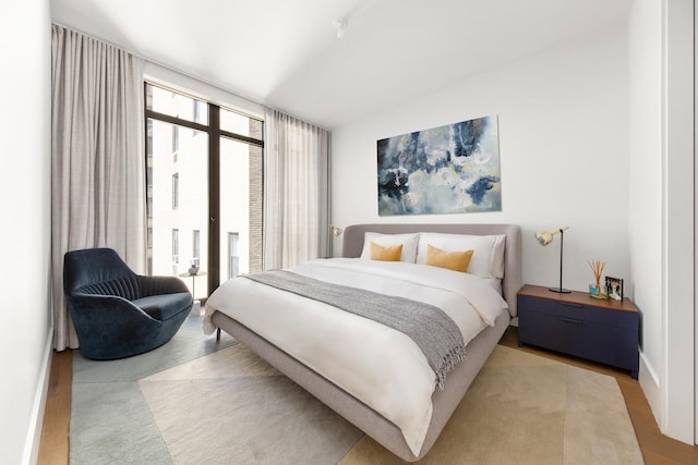bedroom featuring wood finished floors