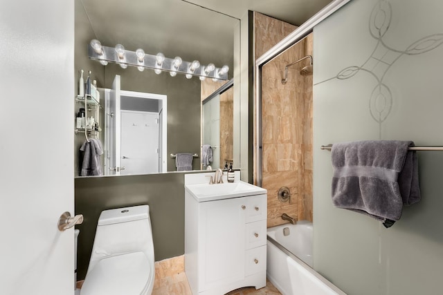 bathroom with vanity, toilet, and enclosed tub / shower combo