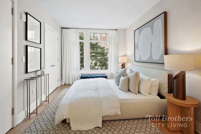 bedroom featuring light wood finished floors